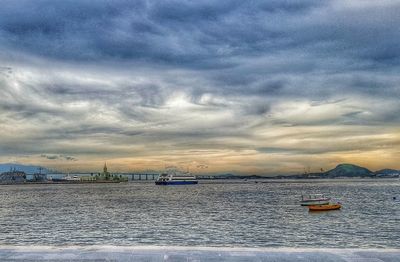 Scenic view of sea against cloudy sky