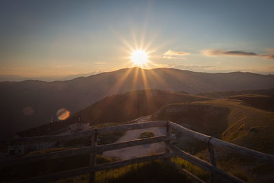 Scenic view of mountains against sky during sunset