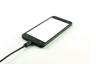 Close-up of smart phone against white background