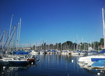 Boats moored at harbor