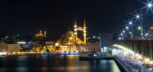 Illuminated buildings in city at night