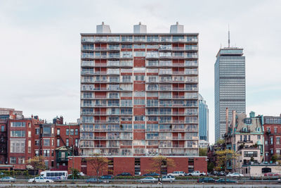 Buildings in city against sky