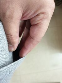 Close-up of person holding hands