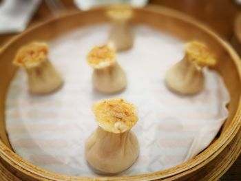 Close-up of chinese dumplings in bamboo bowl