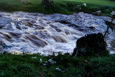 Scenic view of stream flowing through rocks