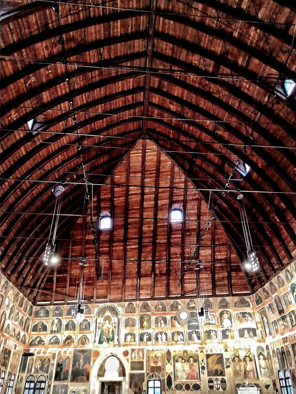 LOW ANGLE VIEW OF ILLUMINATED CEILING LIGHTS