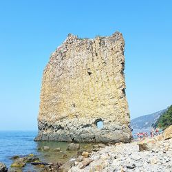 Sail rock at black sea against clear blue sky