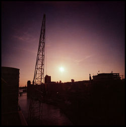 Silhouette of cranes at sunset