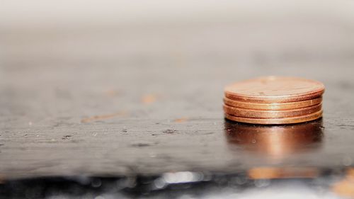 Close-up of coin on table