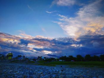 Scenic view of land against sky during sunset