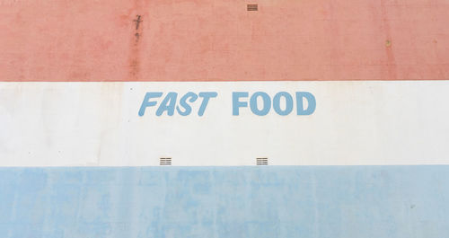 Close-up of text on wall