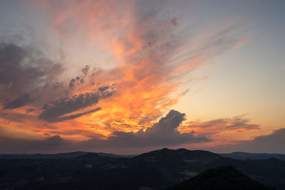 Scenic view of dramatic sky during sunset