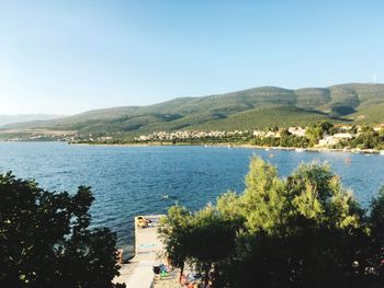 Scenic view of sea against clear blue sky