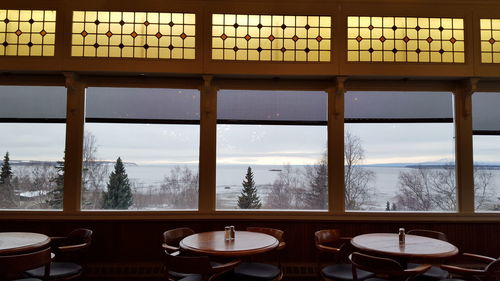 Interior of restaurant against sea