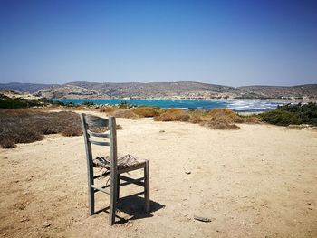 Scenic view of beach against clear blue sky