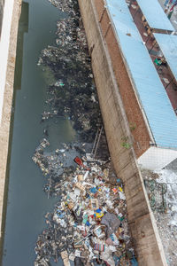 High angle view of garbage floating on water