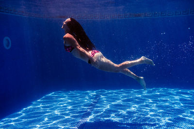 Woman swimming in sea