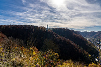 Scenic view of tree mountains against sky