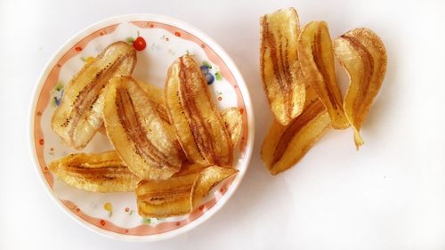 High angle view of bread and fries in plate