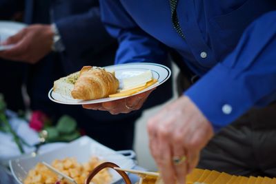 Midsection of people having food