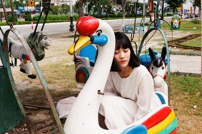 Woman riding in a carousel