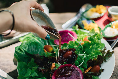 Close-up of hand holding vegetables