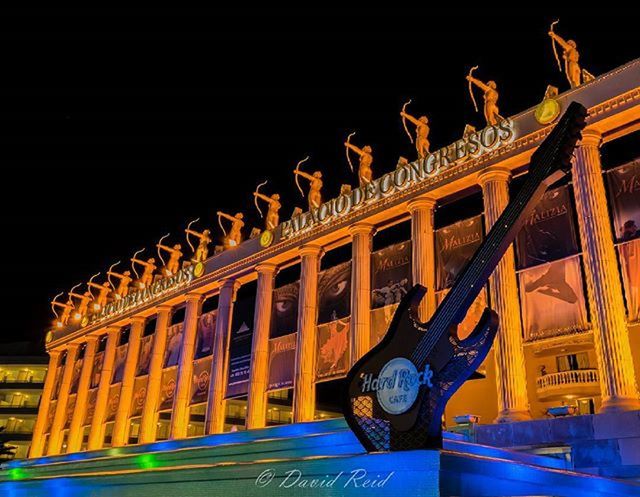 architecture, built structure, building exterior, night, illuminated, clear sky, low angle view, travel destinations, famous place, travel, history, copy space, building, architectural column, facade, sky, incidental people, outdoors, art, city