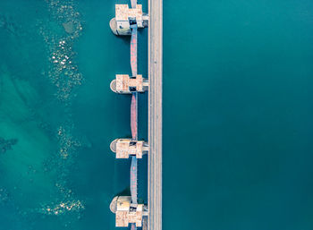 Top view of the dam, drainage of water through locks, industrial concept banner in blue.