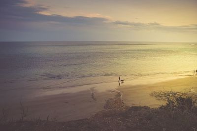 Scenic view of sea against sky at sunset