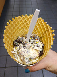 Close-up of hand holding ice cream