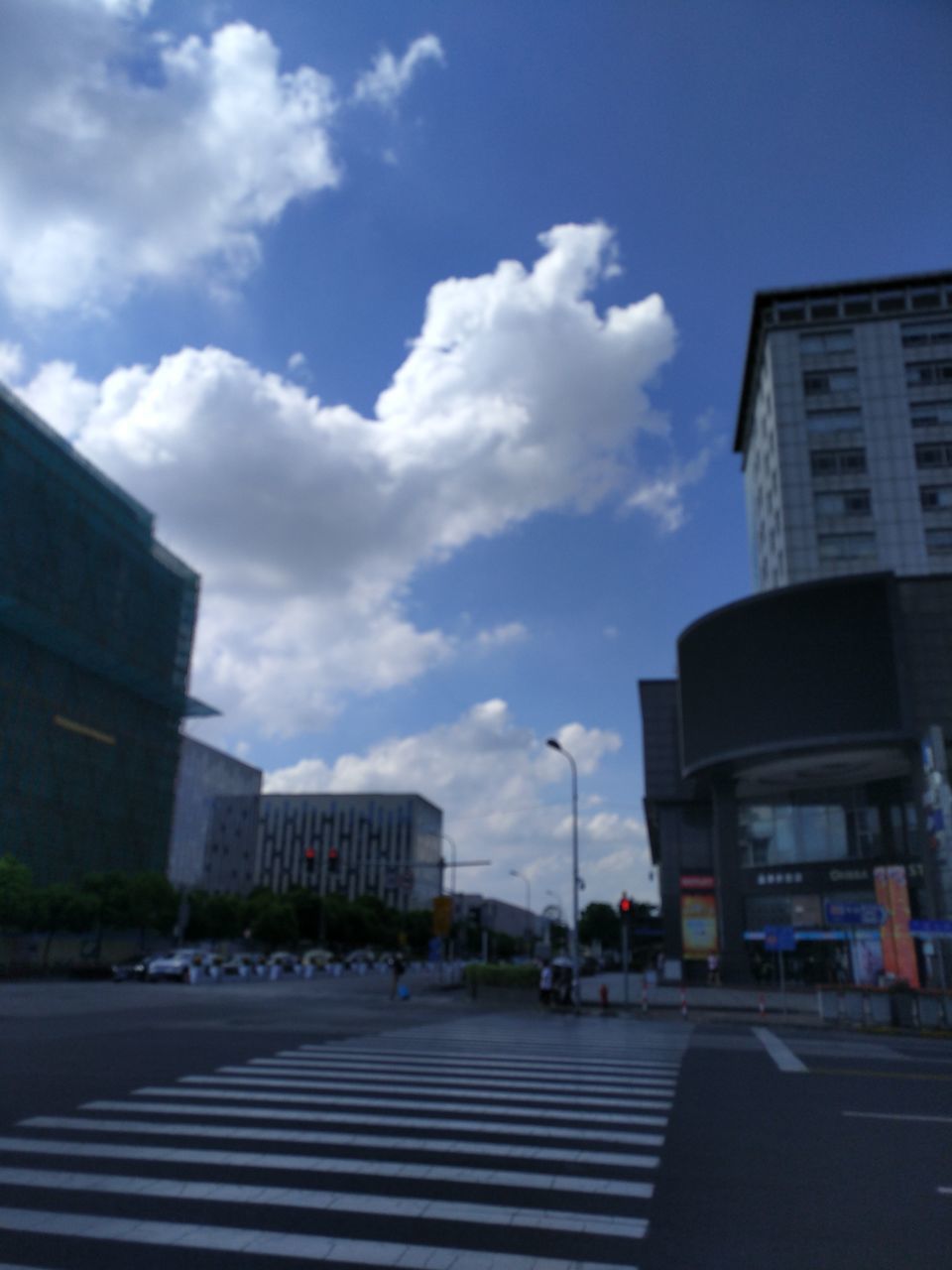 architecture, building exterior, built structure, city, sky, outdoors, cloud - sky, day, modern, road, no people