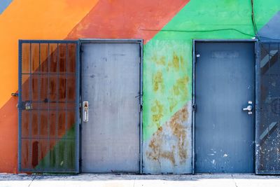 Multi-colored view of rusty doors of an old building