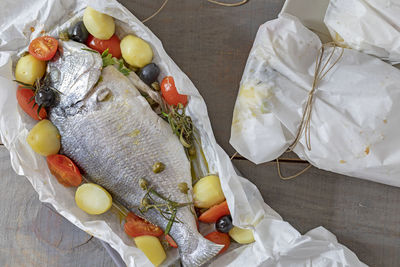 High angle view of fish served on table