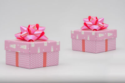 Close-up of colored pencils in box against white background