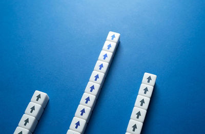 High angle view of thermometer on blue background