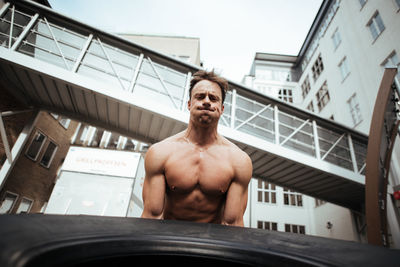 Mature man exercising in backyard