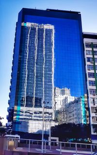 Low angle view of buildings against blue sky