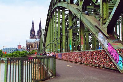 Bridge in city against sky