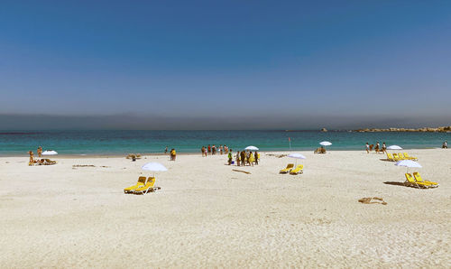 Scenic view of beach against clear sky