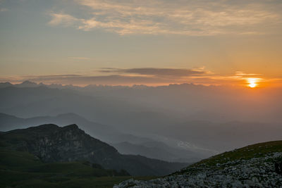 Scenic view of mountains against sky during sunset