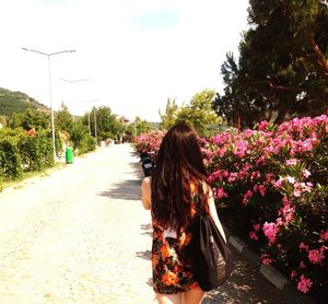 Woman walking on road