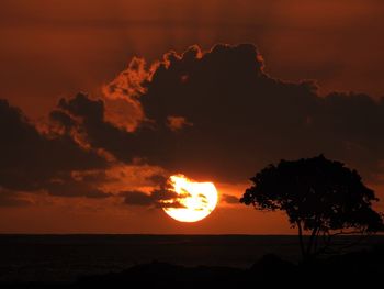 Scenic view of sea against romantic sky at sunset