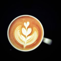 Close-up of cappuccino served on table