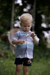 Blonde boy two years old watches broken blows rally from law