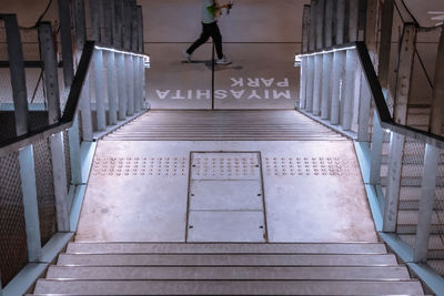 High angle view of person walking on staircase