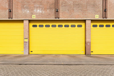 Closed yellow shutter of garages
