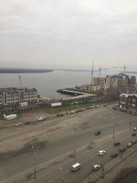 Airplane on beach in city against sky