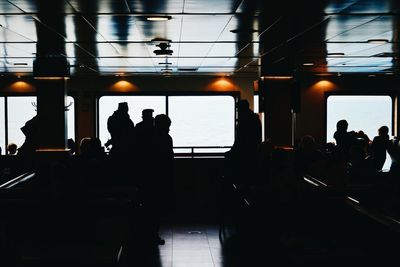 Silhouette people in bus