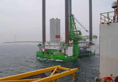 Wind farm offshore energy wind turbine construction on the north sea