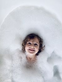 Portrait of kid in bathtub